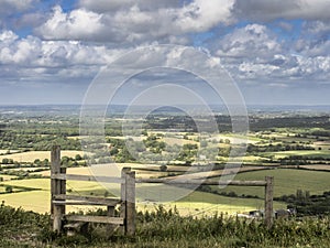 Tunning vibrant landscape image of English countryside on lovely Summer afternoon overlooking rolling hills and country villages