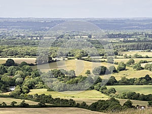 Tunning vibrant landscape image of English countryside on lovely Summer afternoon overlooking rolling hills and country villages