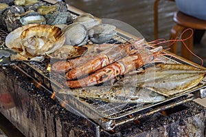 Turban shell,clam,Quahog,shrimp,scallop shell,Horse mackerel, Charcoal-grilled seafood.in chiba-ken JAPAN photo