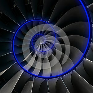 Turbine blades wings spiral blue neon glow effect abstract fractal pattern background. Spiral industrial production metallic turbi