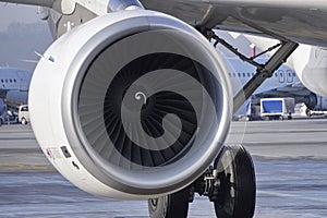 Turbine jet engine CFMI CFM56-5B passenger aircraft airbus A320, on the background of the runway. turbine blades, civil aviation,