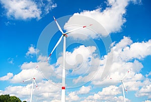 Turbine or windmill blue sky background. Alternative energy source. Go green eco friendly technology. Clean fuel energy