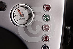 Turbo pressure dial and various status lights of high performance car