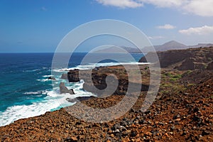 Turbulent ocean waves crashing into rocky shoreline of Sao Nicolau island, Cape Verde