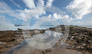 Turbulent storm waves crashing into Laie Point coastline at Kaawa on the North Shore of Oahu Hawaii USA