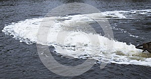 Turbulent Water Behind Boat in River