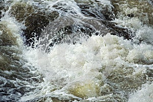 Turbulent water of Cargill Falls in Putnam, Connecticut in springtime