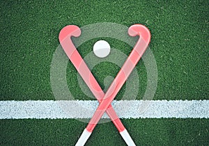 Turf field, hockey stick or sports ball on the ground for fitness competition, exercise contest or practice match. Green