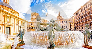 Valencia old town and Turia Fountain on Plaza de la Virgen photo