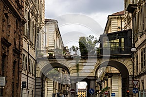 TURIN, ITALY - 25 May 2019: Passage with plants and Turin street view, Torino, Italy - Image