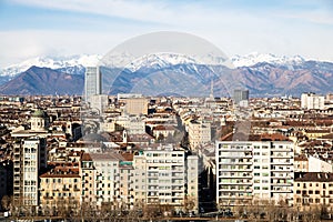 Turin overview with snow covered mountains at the background, Italy