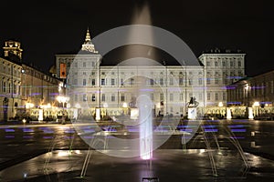 Turin, Piedmont, Italy. Night view of a fountain in piazza castello