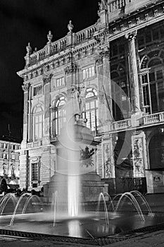 Turin, Piedmont, Italy. Night view of piazza castello in black and white with madama palace behind the fountain