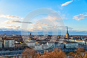 Turin skyline at sunset. Torino, Italy, panorama cityscape with the Mole Antonelliana over the city. Scenic colorful light and