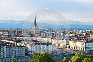 Turin skyline at sunset, Torino, Italy, panorama cityscape with the Mole Antonelliana over the city. Scenic colorful light and dra