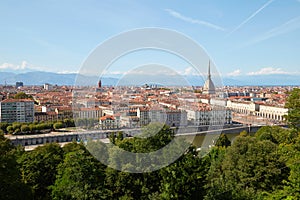 Turin skyline view and Mole Antonelliana tower seen from Cappuccini hill in a summer day in Italy