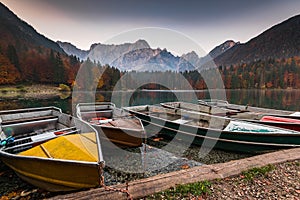 Turist boats at Fusine Lakes in Italy