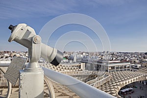 Turistic telescope pointing to old town landmarks, Seville, Spain