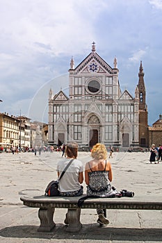 Turists looking SantaCroce church in Florence