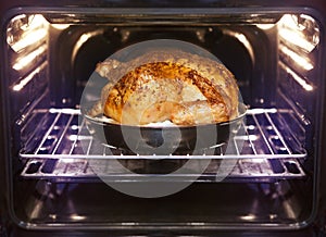 Turkey is baked in oven