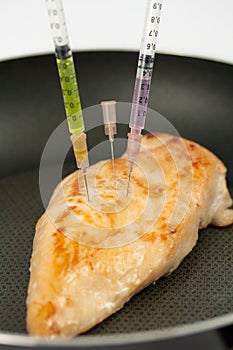 Turkey breast with syringes photo