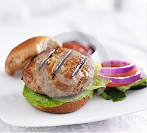 Turkey burger on bun with lettuce and fixings