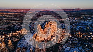 Turkey. Cappadocia. aerial View on rock-castle of Uchisar castle at a sunset