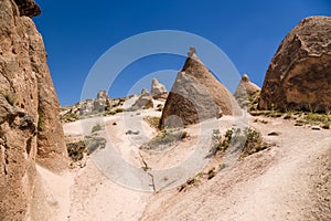 Turkey, Cappadocia. Beautiful mountain landscape with pillars of weathering in the valley Devrent