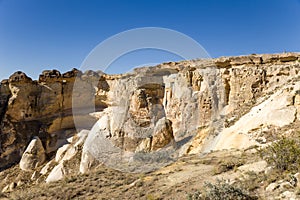 Turkey, Cappadocia. Rocks around Cavusin with carved caves in them