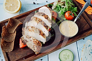 Turkey fillet with cheese sauce and vegetables