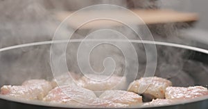 Turkey fillet pieces frying on nonstick pan