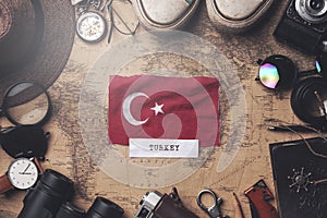 Turkey Flag Between Traveler`s Accessories on Old Vintage Map. Overhead Shot