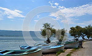 Turkey. Golyazi Lake, Bursa Turkey. Fisherman goes by boats to the fishing. Small boat hangs on the tree near the lake