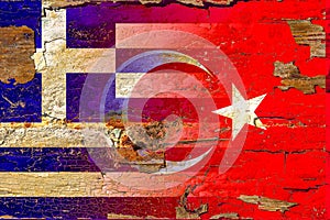 Turkey and greece flag on old wood.