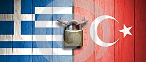 Turkey and Greece relation. Turkish and Greek flags on wooden door with padlock. 3d illustration