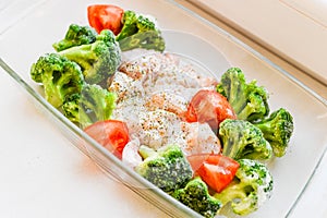 Turkey legs with vegetables. before baking in the oven. Fried chicken legs with white rice and vegetables