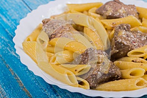 Turkey liver with pasta on a plate