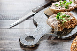 Turkey liver pate on whole grain baguette with microgreens