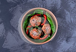 Turkey meatballs with teriyaki glazing sauce in cardboard container