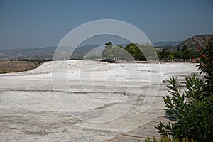 Turkey. Pamukkale Park and ancient Hierapolis. View of the mineral deposits on a plateau on a sunny day