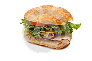 A turkey sandwich on a croissant