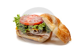 A turkey sandwich on a croissant