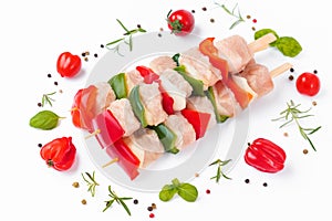 Turkey Skewers breast fillet.Raw turkey skewers with vegetables,peppers,onions white background.Skewers with pieces of