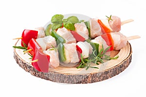 Turkey Skewers breast fillet.Raw turkey skewers with vegetables,peppers,onions white background.Skewers with pieces of