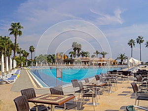 Turkey Swimming pool with the some beach lounges at the luxury tropical resort.