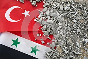 Turkey and Syria Earthquake, A background of the Turkish and Syria flag and brick debris photo