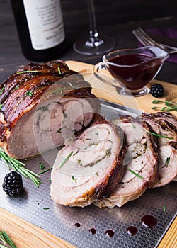 Turkey Thigh Roll Stuffed Rosemary, Thyme, Parsley, Butter and Bacon on the top with Spicy Blackberry Sauce