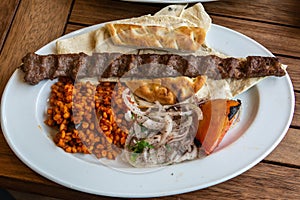 Turkish Adana kebab with bulgur cereals