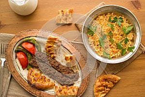 Turkish Adana Kebab with bulgur rice and ayran.