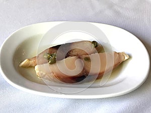 Turkish appetizer Pickled Tunny Fish with Olive Oil